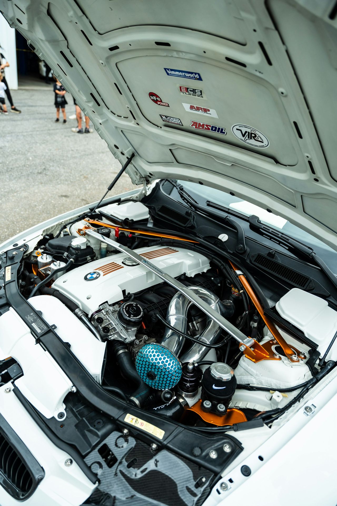 The engine compartment of a car with its hood open